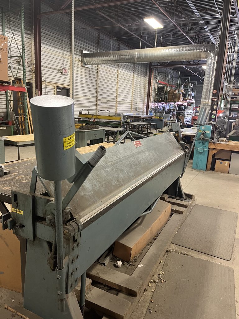 Sheet metal brake press machine in HVAC fabrication shop